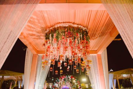 Peach wedding decor with hanging floral strings