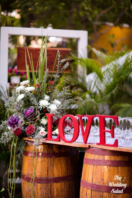 Photo of LOVE decor with floral arrangements