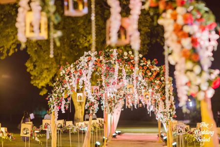 Photo of Beautiful hanging floral arrangements in night decor