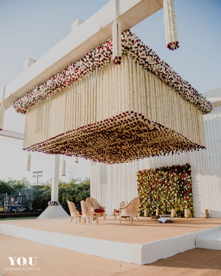 Unique mandap decor with floral string ceiling 