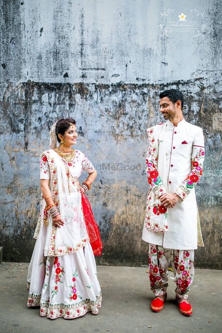 Bride and groom in matching floral print outfits