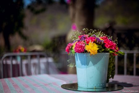 Photo of Centrepiece idea with flowers in bucket