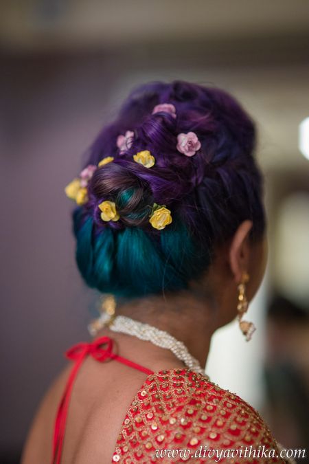 Coloured hair with small flowers in bun