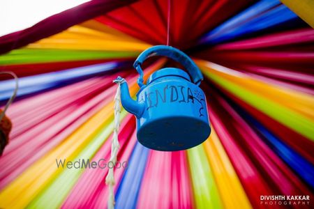 Hanging blue tea kettle in decor