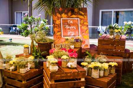 Photo of Wooden boxed with floral arrangements in decor