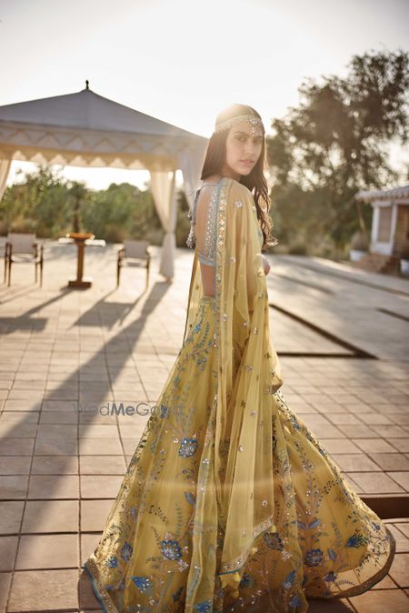 Photo of Yellow anf turquoise mehendi lehenga