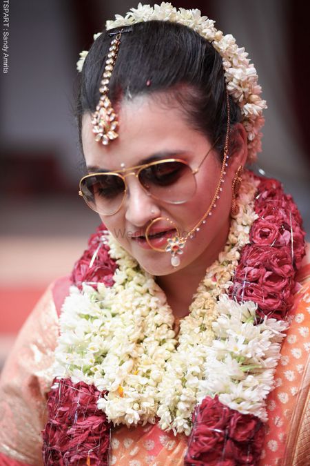 Photo of bride wearing sunglasses