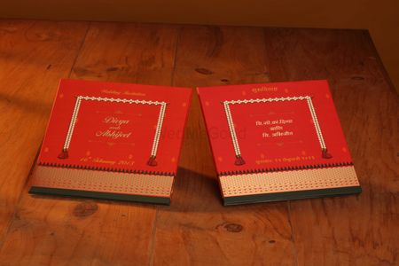 Photo of red and gold wedding invite