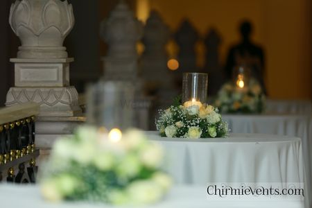 Photo of Simple floral and candle lit table centerpiece