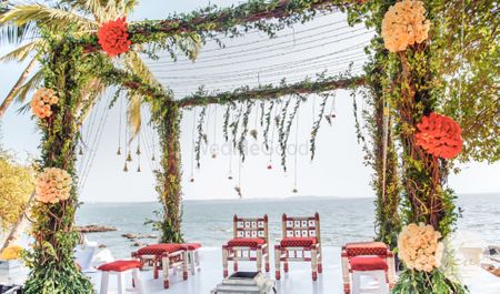 Beautiful beach side mandap done in greenery and colourful flowers