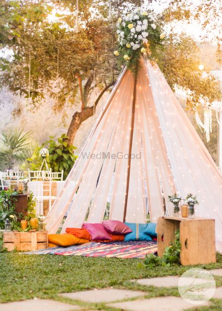 Beautiful outdoor tents with fairy lights and colourful pillows