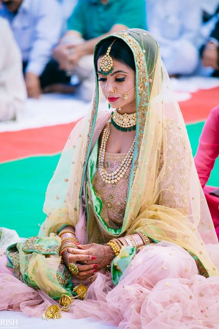 Sikh bride with light pink and blue lehenga 