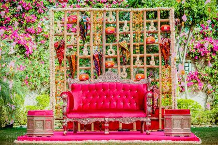 Photo of Bright and colorful mehendi stage decor