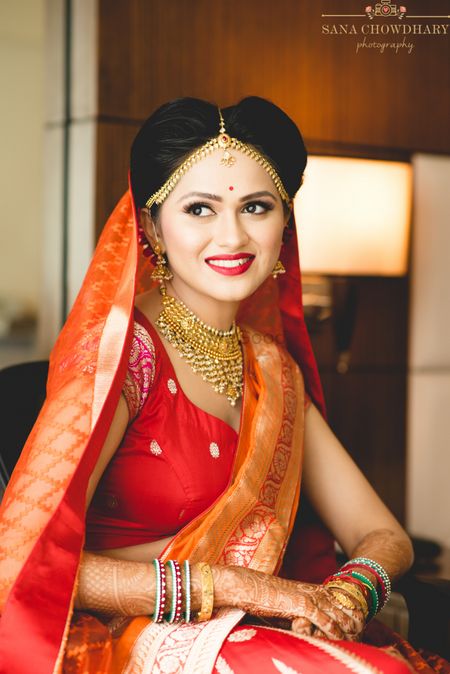 Simple bridal look with benarasi lehenga in red and orange