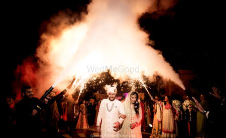 Photo of Couple entry ideas with guests holding cold pyros