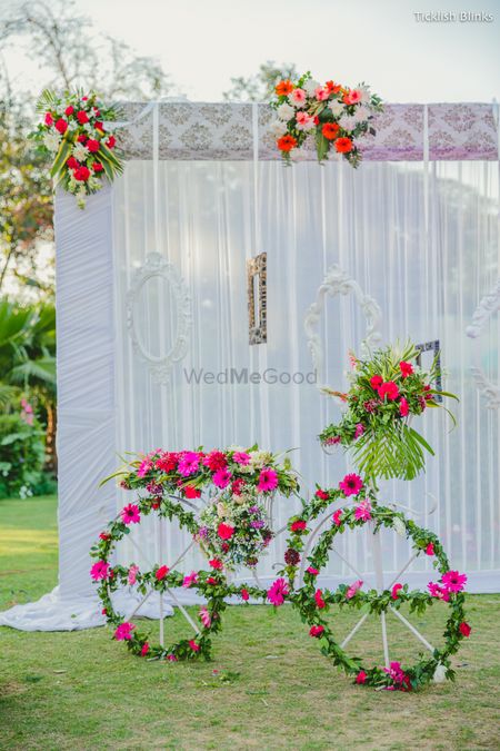 Bicycle prop with floral arrangement all over in green and pink