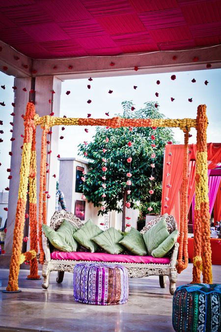 Mehendi jhoola decor with marigolds