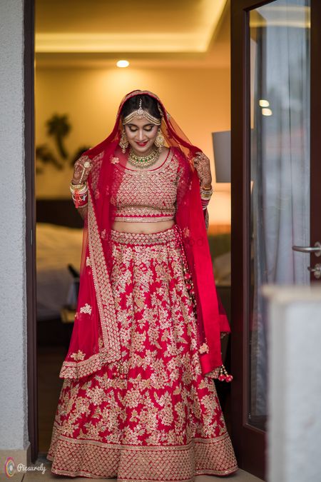 Photo of Red bridal lehenga with floral embroidery work