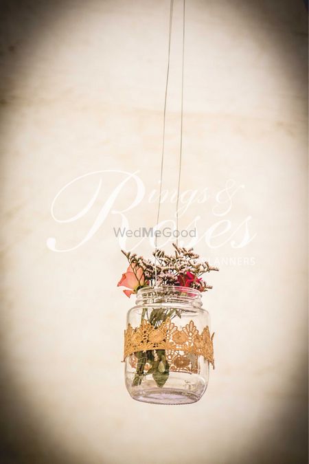 Hanging glass jars with flowers in decor