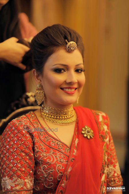 Bride wearing choker necklace and bola