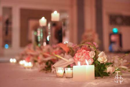 Flowers and candle lit table setting