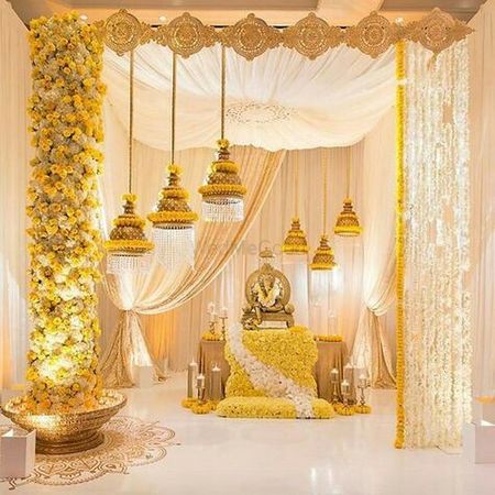 South Indian wedding decor with yellow and white florals