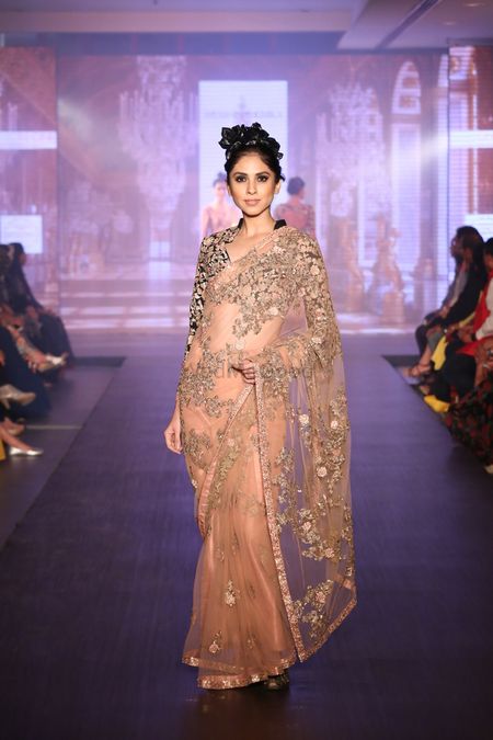 sheer peach saaree with gold work . all over gold work