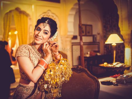 Indian bride posing with earings