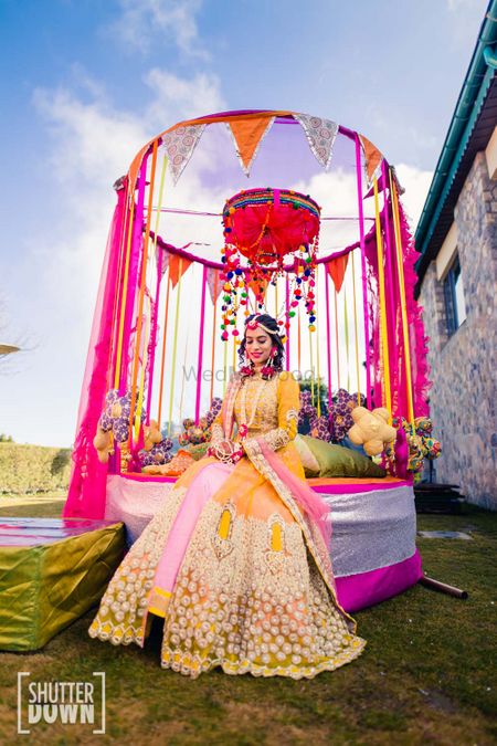 Mehendi look and decor in pink and yellow 