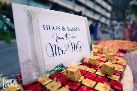 Photo of Wedding favours for guests with cute sign board