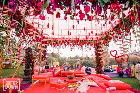 Floral mandap decor with red and pink theme