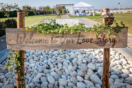Photo of Welcome sign for wedding with rustic finish