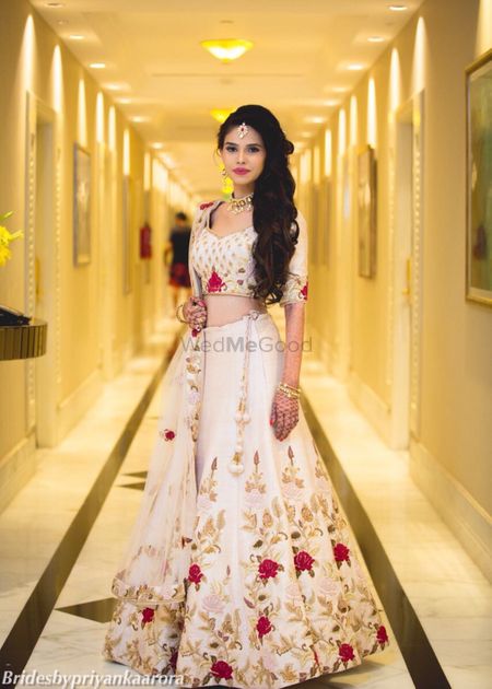 Ivory engagement lehenga with floral embroidery