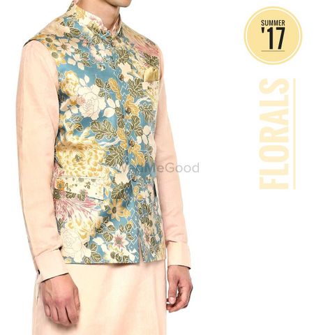 Photo of Mehendi groomwear idea with cream kurta and floral jacket