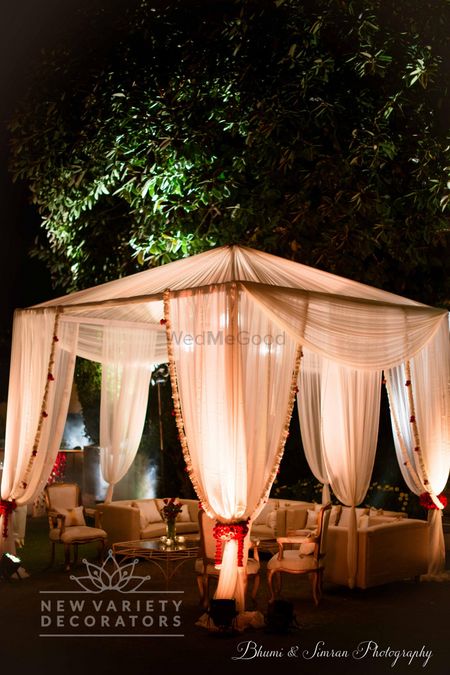 Romantic night decor with white canopies