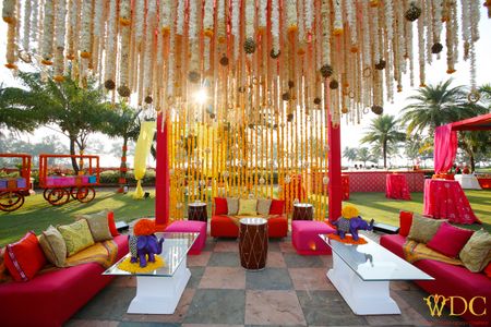 Photo of Fun and playful mehendi decor with pop of colors