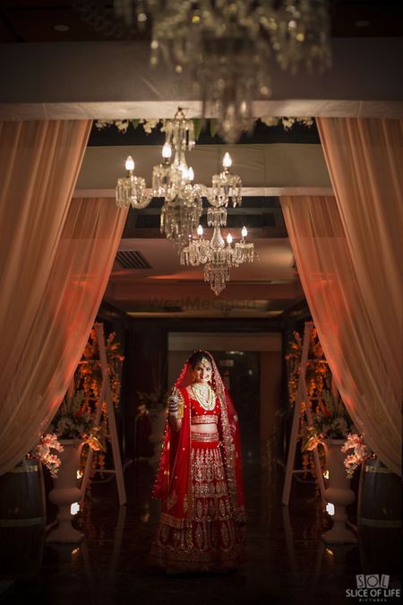 Photo of Classic red and gold bridal lehenga
