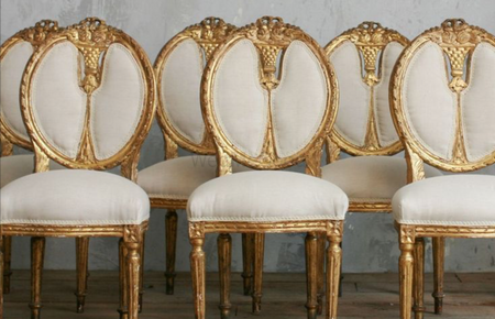 Photo of white and gold chairs