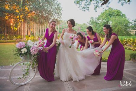 Photo of Bride with coordinated bridesmaids shot