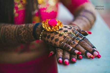 Bridal mehendi hands with lace glove mehendi and gota jewellery