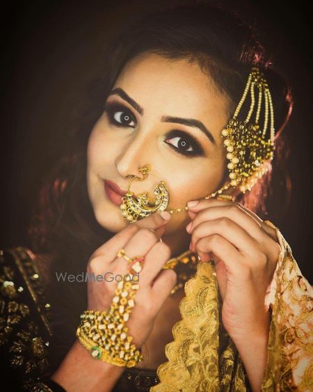 Photo of Gold  green and pearl bridal jewellery