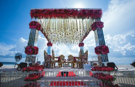 Photo of Red and white floral mandap decor