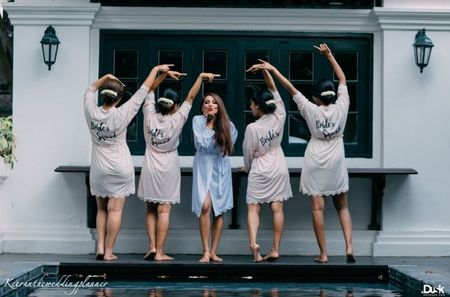 Photo of Bride with bridesmaids in matching robes
