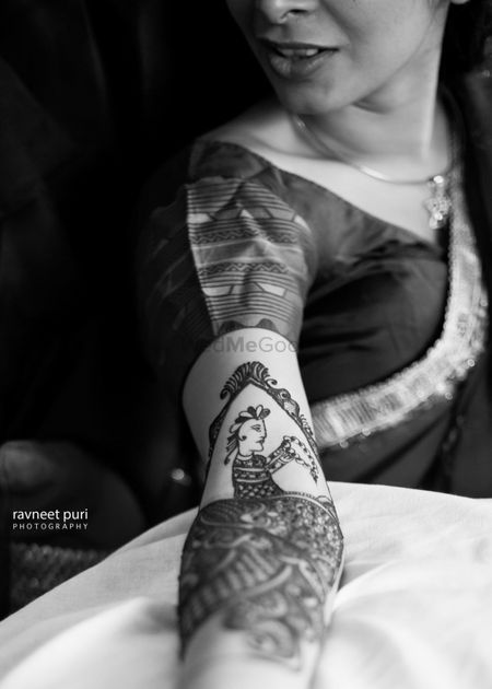 Bridal mehendi design with portraits in black and white