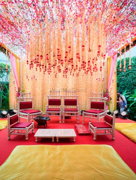 Beautiful outdoor mandap decorwhith white and red hanging floral strings
