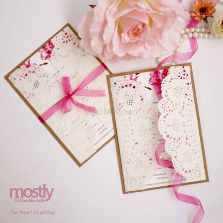 White and pink laser cut wedding cards