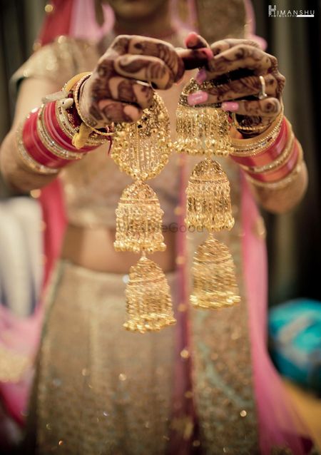 Bride showing off gold bridal kaleere