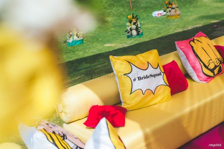 Mehendi decor idea with bride squad cushion