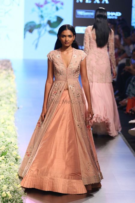 Peach lehenga with a floral printed jacket