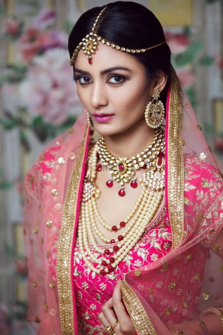 Photo of Pink bridal makeup with heavy contouring